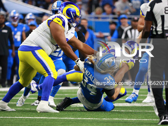 DETROIT,MICHIGAN-SEPTEMBER 8: Los Angeles Rams wide receiver Cooper Kupp (10) is tackled by Detroit Lions linebacker Alex Anzalone (34) duri...