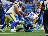 DETROIT,MICHIGAN-SEPTEMBER 8: Los Angeles Rams wide receiver Cooper Kupp (10) is tackled by Detroit Lions linebacker Alex Anzalone (34) duri...