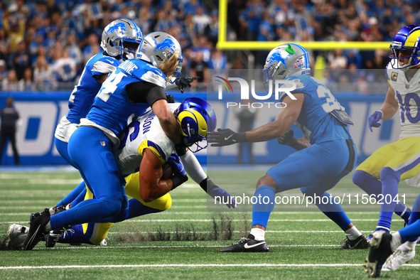 DETROIT,MICHIGAN-SEPTEMBER 8: Los Angeles Rams tight end Colby Parkinson (86) is tackled by Detroit Lions linebacker Alex Anzalone (34) duri...