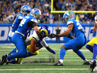 DETROIT,MICHIGAN-SEPTEMBER 8: Los Angeles Rams tight end Colby Parkinson (86) is tackled by Detroit Lions linebacker Alex Anzalone (34) duri...