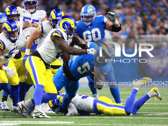 DETROIT,MICHIGAN-SEPTEMBER 8: Detroit Lions running back David Montgomery (5) runs the ball during the first half of an NFL football game be...