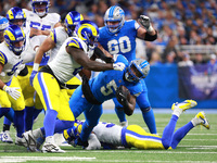 DETROIT,MICHIGAN-SEPTEMBER 8: Detroit Lions running back David Montgomery (5) runs the ball during the first half of an NFL football game be...