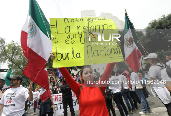 A judiciary worker shouts slogans against the judicial reform proposed by current President Andres Manuel Lopez Obrador while demonstrating...