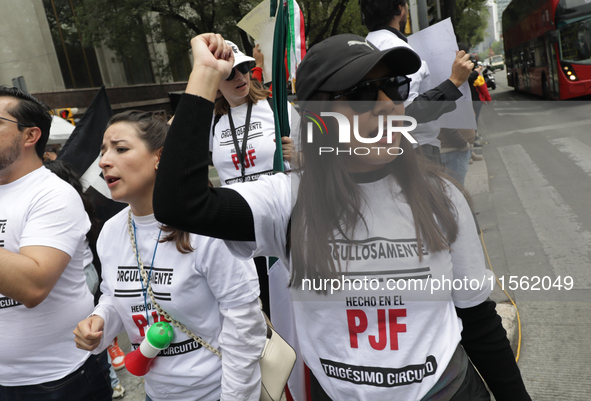 A judiciary worker shouts slogans against the judicial reform proposed by current President Andres Manuel Lopez Obrador while demonstrating...