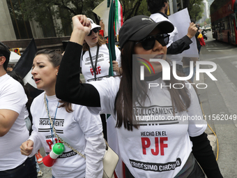 A judiciary worker shouts slogans against the judicial reform proposed by current President Andres Manuel Lopez Obrador while demonstrating...