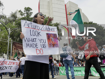 A judiciary worker shouts slogans against the judicial reform proposed by current President Andres Manuel Lopez Obrador while demonstrating...