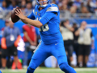 DETROIT,MICHIGAN-SEPTEMBER 8: Detroit Lions quarterback Jared Goff (16) looks to pass during the first half of an NFL football game between...