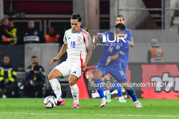 Giacomo Raspadori and Gavriel Kanichowsky in action during Israel vs Italy: matchday 2 of UEFA Nations League 2024-2025, in Budapest, Hungar...