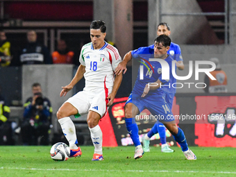 Giacomo Raspadori and Gavriel Kanichowsky in action during Israel vs Italy: matchday 2 of UEFA Nations League 2024-2025, in Budapest, Hungar...