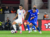 Giacomo Raspadori and Gavriel Kanichowsky in action during Israel vs Italy: matchday 2 of UEFA Nations League 2024-2025, in Budapest, Hungar...