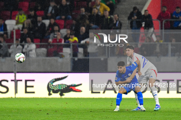 Alessandro Bastoni and Manor Solomon are in action during Israel vs Italy: matchday 2 of UEFA Nations League 2024-2025, at Bozsik Arena in B...