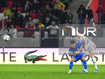 Alessandro Bastoni and Manor Solomon are in action during Israel vs Italy: matchday 2 of UEFA Nations League 2024-2025, at Bozsik Arena in B...