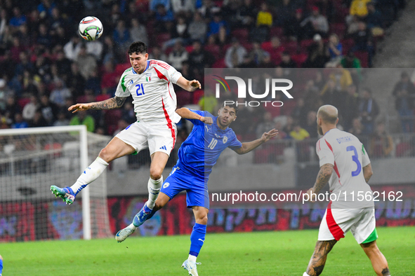 Alessandro Bastoni and Manor Solomon are in action during Israel vs Italy, matchday 2 of the UEFA Nations League 2024-2025, in Budapest, Hun...