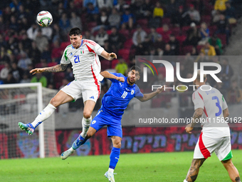 Alessandro Bastoni and Manor Solomon are in action during Israel vs Italy, matchday 2 of the UEFA Nations League 2024-2025, in Budapest, Hun...