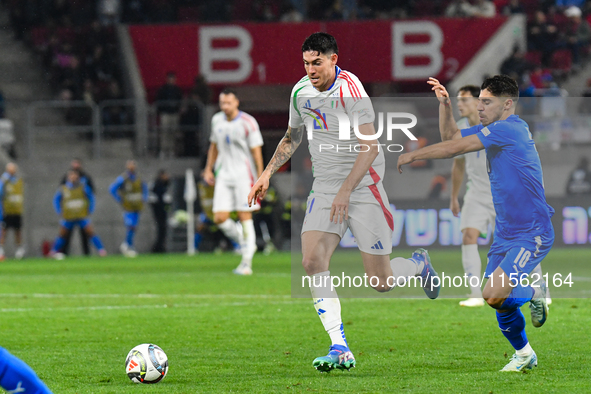 Alessandro Bastoni and Manor Solomon are in action during Israel vs Italy, matchday 2 of the UEFA Nations League 2024-2025, in Budapest, Hun...