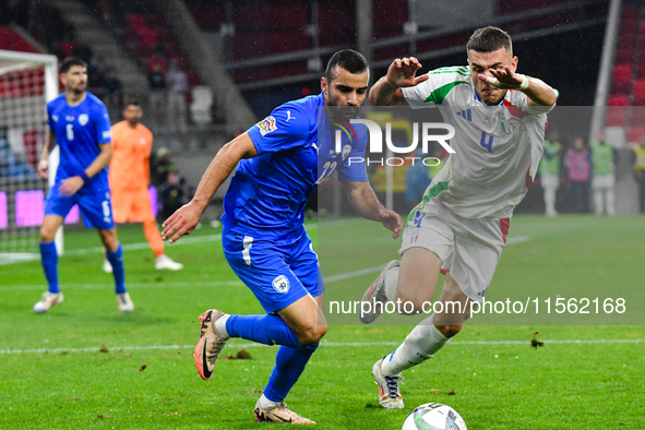 Alessandro Buongiorno and Mahmoud Jaber are in action during Israel vs. Italy, matchday 2 of the UEFA Nations League 2024-2025, in Budapest,...