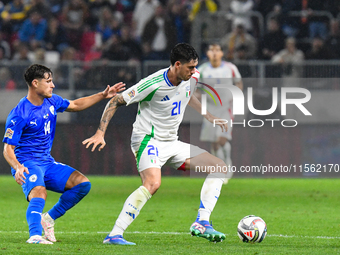 Alessandro Bastoni and Gavriel Kanichowsky are in action during Israel vs Italy: matchday 2 of UEFA Nations League 2024-2025, in Budapest, H...