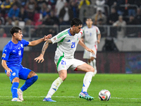 Alessandro Bastoni and Gavriel Kanichowsky are in action during Israel vs Italy: matchday 2 of UEFA Nations League 2024-2025, in Budapest, H...