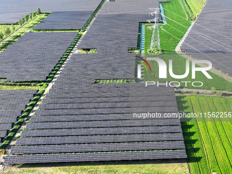 Solar photovoltaic panels are seen in Lihua Village in Lianyungang, China, on September 10, 2024. (