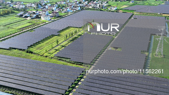 Solar photovoltaic panels are seen in Lihua Village in Lianyungang, China, on September 10, 2024. 