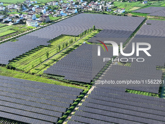 Solar photovoltaic panels are seen in Lihua Village in Lianyungang, China, on September 10, 2024. (