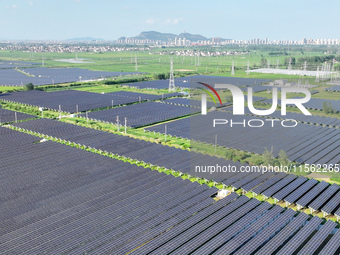 Solar photovoltaic panels are seen in Lihua Village in Lianyungang, China, on September 10, 2024. (