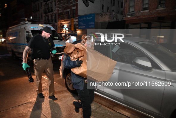 Crime scene investigators collect evidence, search for clues, and investigate the shooting death of 57-year-old Ying Zhu Liu, who is shot in...