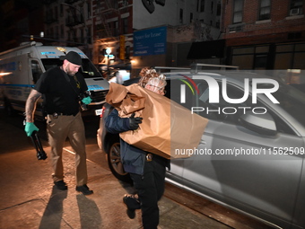 Crime scene investigators collect evidence, search for clues, and investigate the shooting death of 57-year-old Ying Zhu Liu, who is shot in...