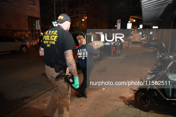 Crime scene investigators collect evidence, search for clues, and investigate the shooting death of 57-year-old Ying Zhu Liu, who is shot in...