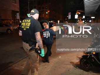 Crime scene investigators collect evidence, search for clues, and investigate the shooting death of 57-year-old Ying Zhu Liu, who is shot in...