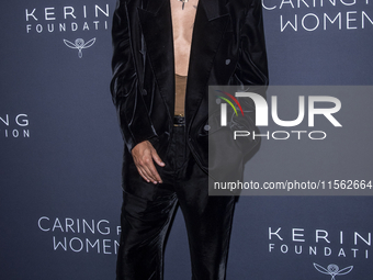 Evan Ross attends Kering's 3rd Annual Caring for Women Dinner at The Pool in New York, USA, on September 9, 2024. (