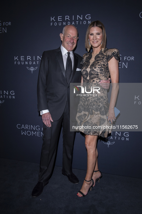 Jonathan Tisch and Lizzie Tisch attend Kering's 3rd Annual Caring for Women Dinner at The Pool in New York, USA, on September 9, 2024. 