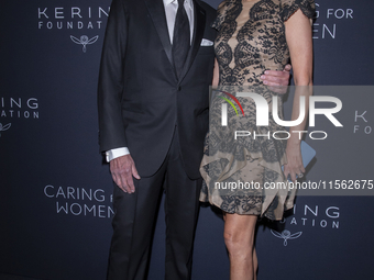 Jonathan Tisch and Lizzie Tisch attend Kering's 3rd Annual Caring for Women Dinner at The Pool in New York, USA, on September 9, 2024. (