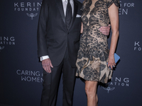 Jonathan Tisch and Lizzie Tisch attend Kering's 3rd Annual Caring for Women Dinner at The Pool in New York, USA, on September 9, 2024. (