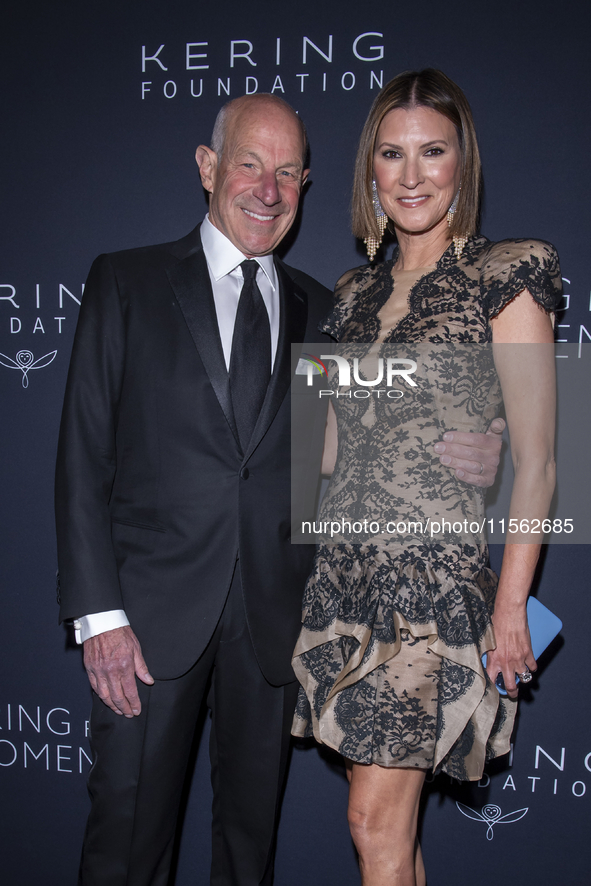 Jonathan Tisch and Lizzie Tisch attend Kering's 3rd Annual Caring for Women Dinner at The Pool in New York, USA, on September 9, 2024. 