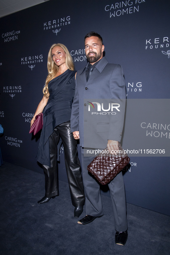 Esther Canadas and Ricky Martin attend Kering's 3rd Annual Caring for Women Dinner at The Pool in New York, USA, on September 9, 2024. 