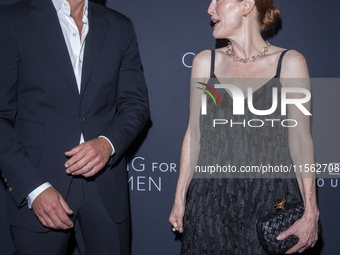 Bart Freundlich and Julianne Moore attend Kering's 3rd Annual Caring for Women Dinner at The Pool in New York, USA, on September 9, 2024. (