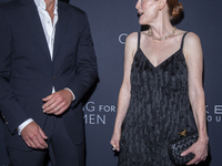 Bart Freundlich and Julianne Moore attend Kering's 3rd Annual Caring for Women Dinner at The Pool in New York, USA, on September 9, 2024. (