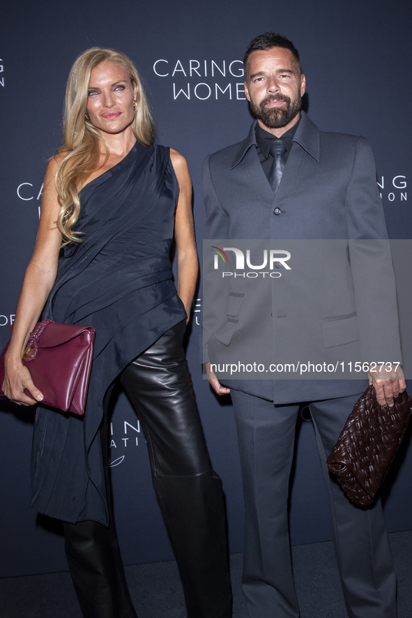 Esther Canadas and Ricky Martin attend Kering's 3rd Annual Caring for Women Dinner at The Pool in New York, USA, on September 9, 2024. 