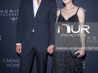 Bart Freundlich and Julianne Moore attend Kering's 3rd Annual Caring for Women Dinner at The Pool in New York, USA, on September 9, 2024. (