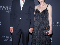 Bart Freundlich and Julianne Moore attend Kering's 3rd Annual Caring for Women Dinner at The Pool in New York, USA, on September 9, 2024. (