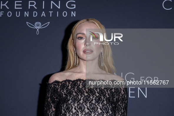 Lindsay Lohan attends Kering's 3rd Annual Caring for Women Dinner at The Pool in New York, USA, on September 9, 2024. 