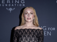 Lindsay Lohan attends Kering's 3rd Annual Caring for Women Dinner at The Pool in New York, USA, on September 9, 2024. (