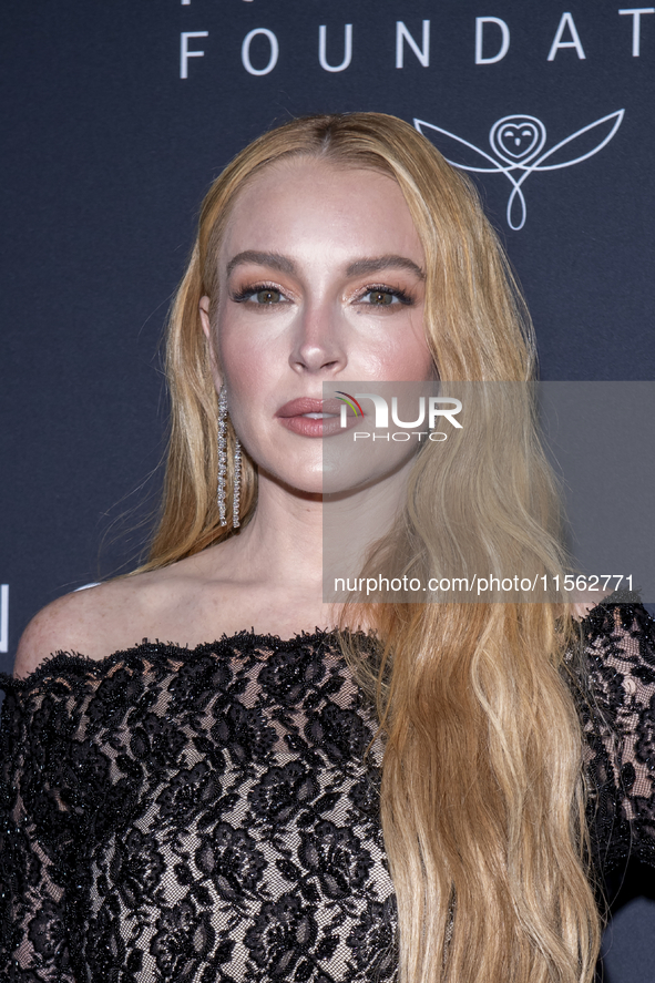 Lindsay Lohan attends Kering's 3rd Annual Caring for Women Dinner at The Pool in New York, USA, on September 9, 2024. 