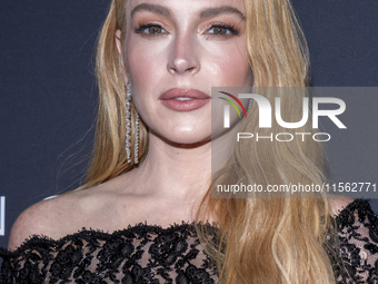 Lindsay Lohan attends Kering's 3rd Annual Caring for Women Dinner at The Pool in New York, USA, on September 9, 2024. (