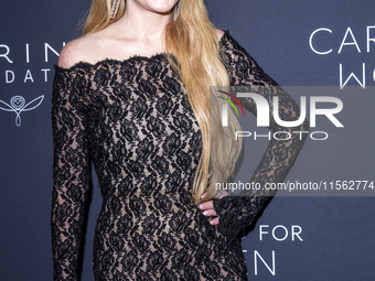 Lindsay Lohan attends Kering's 3rd Annual Caring for Women Dinner at The Pool in New York, USA, on September 9, 2024. (