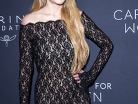 Lindsay Lohan attends Kering's 3rd Annual Caring for Women Dinner at The Pool in New York, USA, on September 9, 2024. (