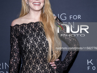 Lindsay Lohan attends Kering's 3rd Annual Caring for Women Dinner at The Pool in New York, USA, on September 9, 2024. (