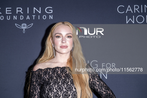 Lindsay Lohan attends Kering's 3rd Annual Caring for Women Dinner at The Pool in New York, USA, on September 9, 2024. 