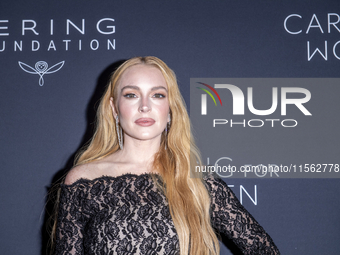 Lindsay Lohan attends Kering's 3rd Annual Caring for Women Dinner at The Pool in New York, USA, on September 9, 2024. (